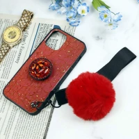 قاب ماربل طلایی پوم پوم دار + پاپ سوکت الماسی آیفون iPhone 12