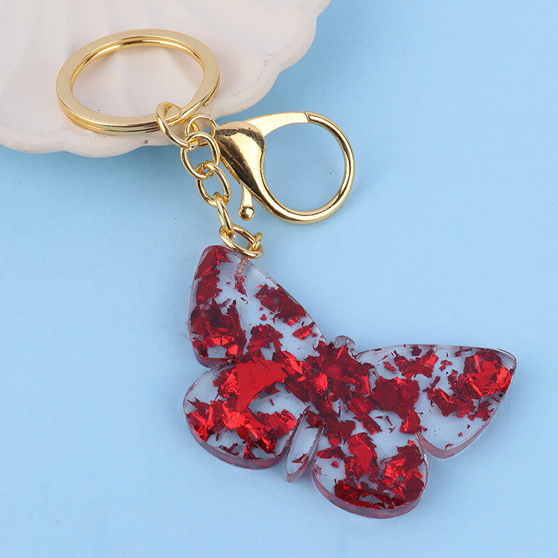 جاکلیدی رزینی گلد طرح پروانه شب تاب