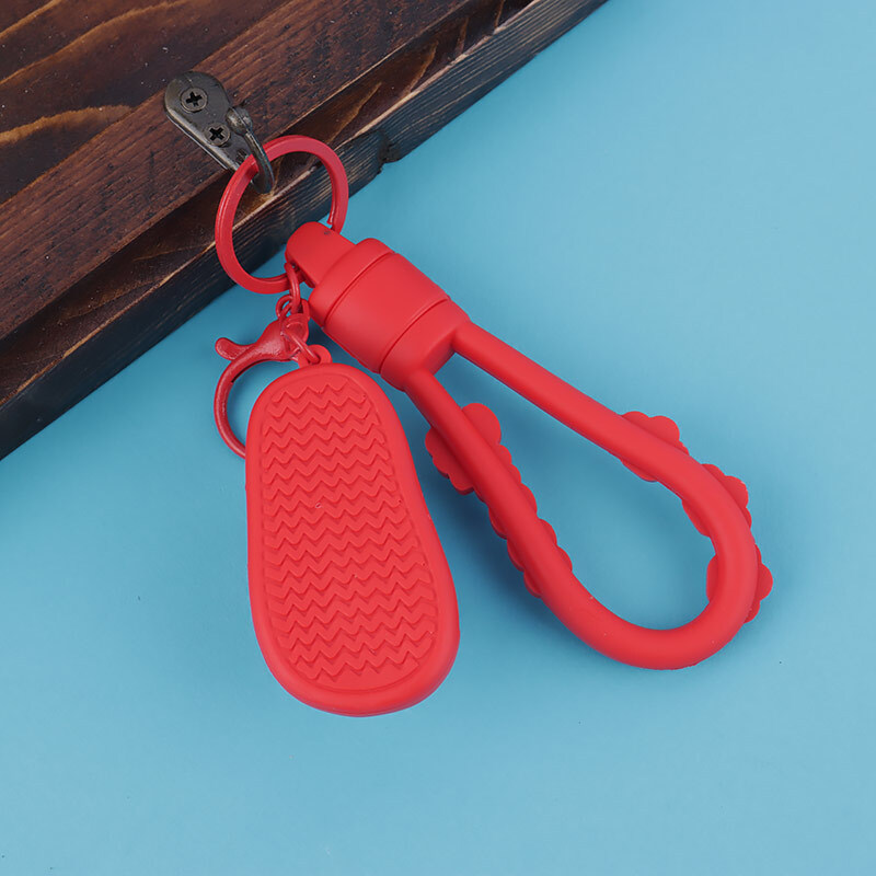 جاکلیدی سیلیکونی اسپینر دار طرح دمپایی + بند آویز