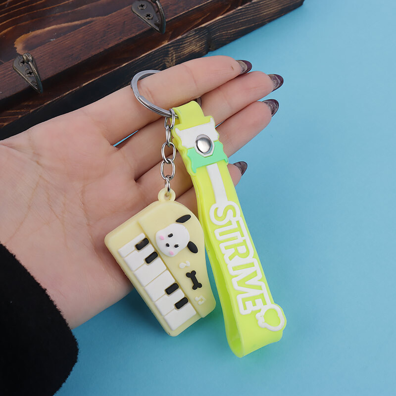 جاکلیدی سیلیکونی طرح پیانو + بند آویز