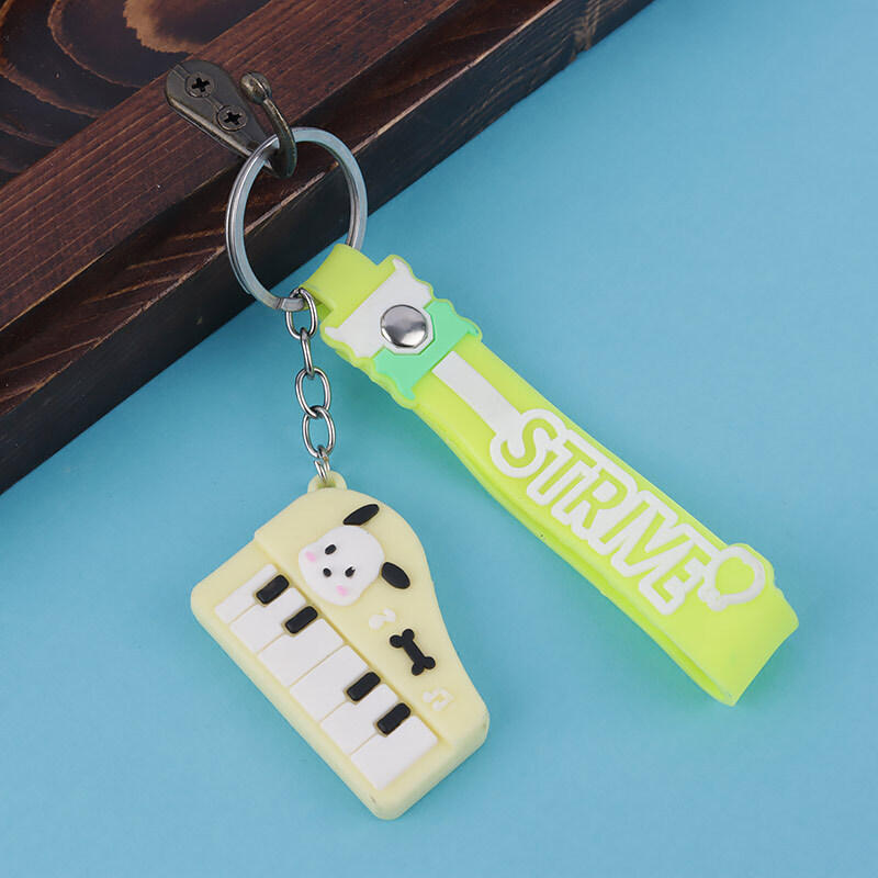 جاکلیدی سیلیکونی طرح پیانو + بند آویز