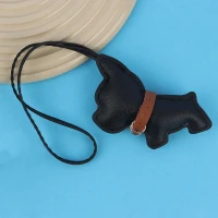 آویز کیف چرمی طرح سگ سیاه