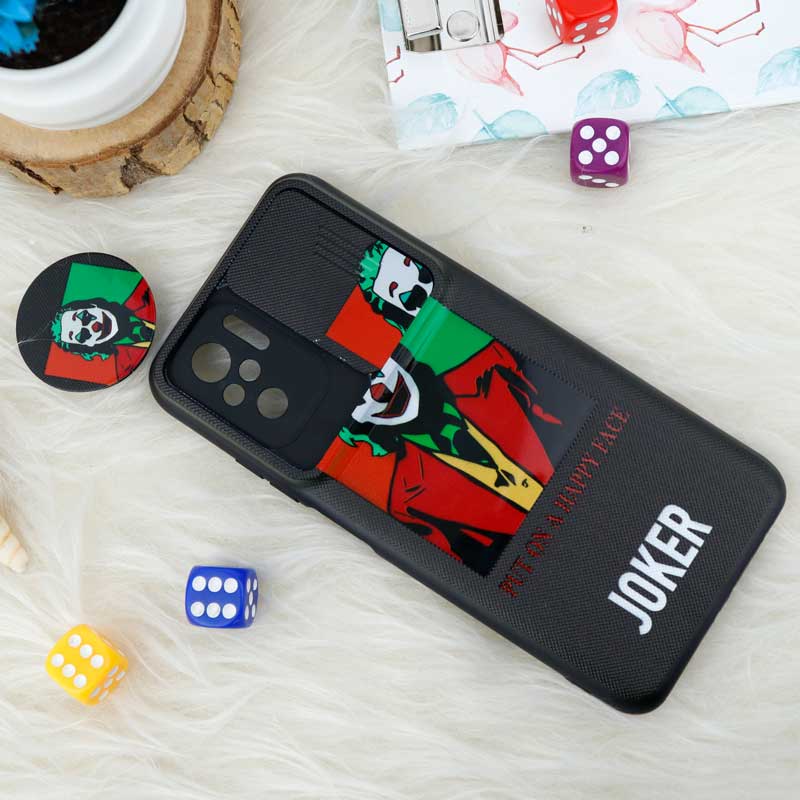 قاب طرحدار محافظ لنز دار کشویی + پاپ سوکت طرح جوکر شیائومی Redmi Note 10 / Note 10s