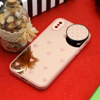 قاب محافظ لنزدار آینه ای + پاپ سوکت طرح قلب صورتی iPhone X/XS