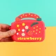 کیف هندزفری سیلیکونی بنددار چمدانی Strawberry