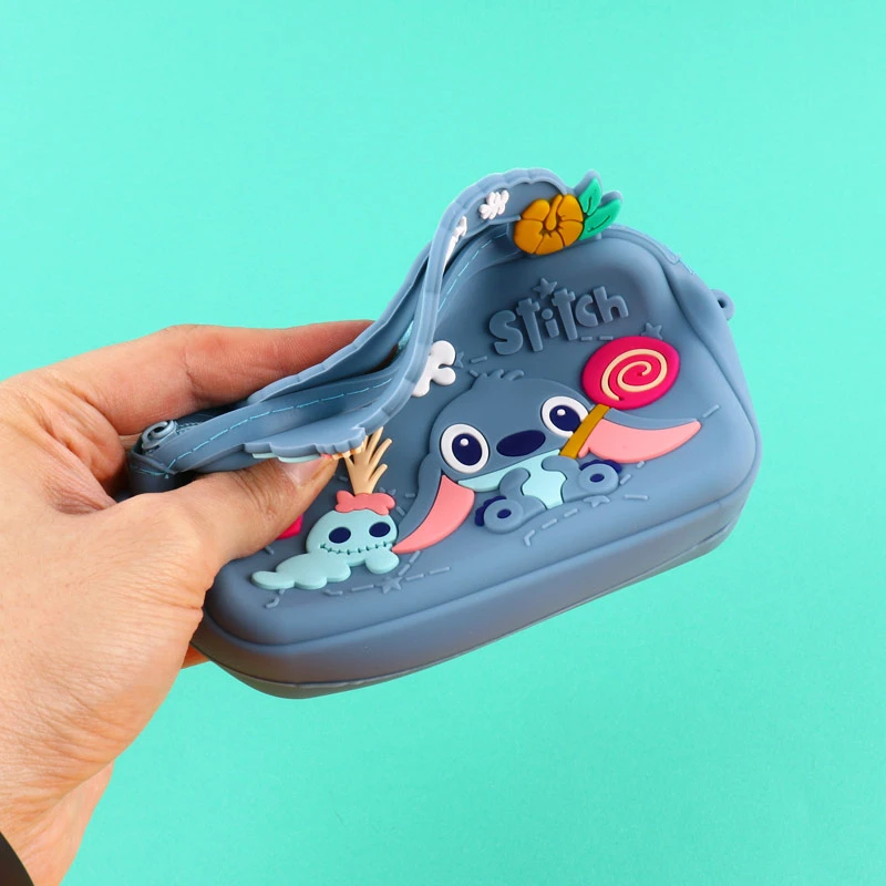 کیف هندزفری سیلیکونی بنددار چمدانی Stitch